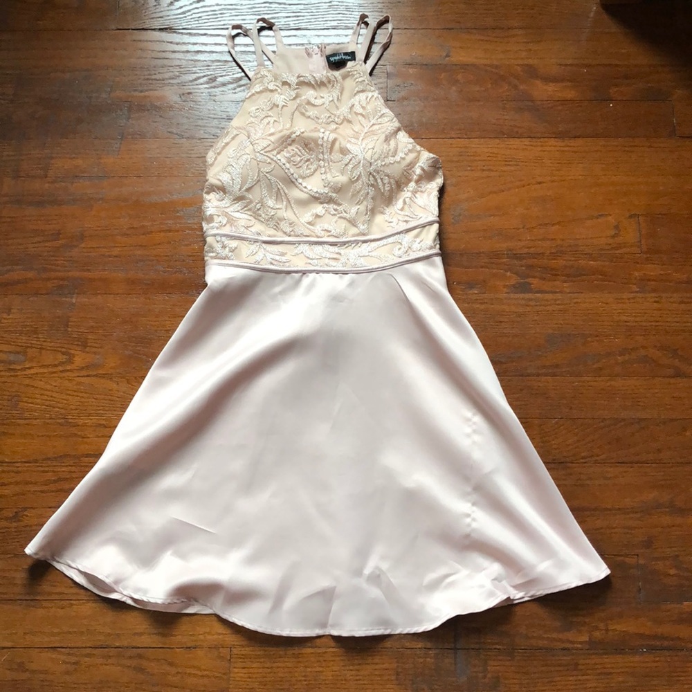 a creme colored dress with pockets. worn once.